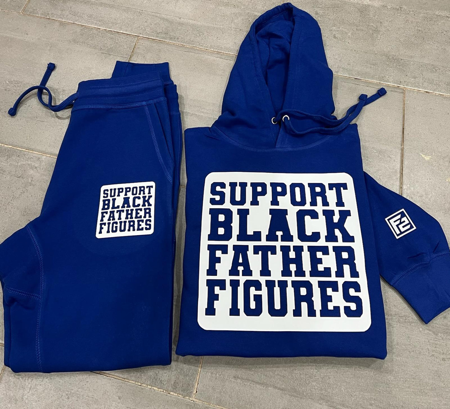 Stylish red and white F2 "SBF2" jogger set for fall/winter, featuring a cozy, high-quality design for ultimate comfort.