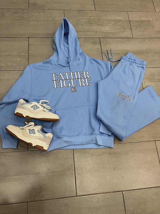 Blue hoodie and shorts set with a sneaker on a wooden floor