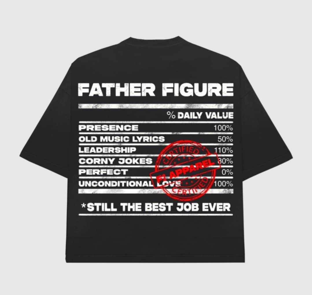 Black t-shirt with a bold white ‘Father Figure’ design mimicking a nutrition label. Lists traits like presence, leadership, and unconditional love, stamped with a red ‘Certified F2 Apparel’ mark and the phrase ‘Still the Best Job Ever.