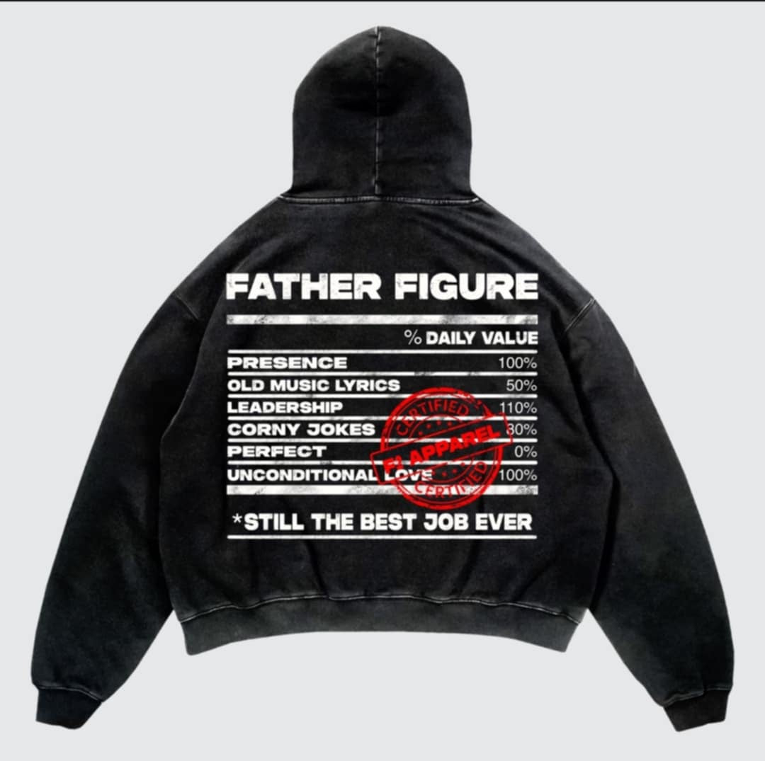 Black hoodie with a bold white ‘Father Figure’ design mimicking a nutrition label. Lists traits like presence, leadership, and unconditional love, stamped with a red ‘Certified F2 Apparel’ mark and the phrase ‘Still the Best Job Ever.