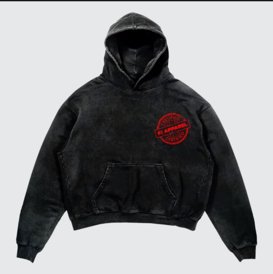 Black hoodie with a bold white ‘Father Figure’ design mimicking a nutrition label. Lists traits like presence, leadership, and unconditional love, stamped with a red ‘Certified F2 Apparel’ mark and the phrase ‘Still the Best Job Ever.