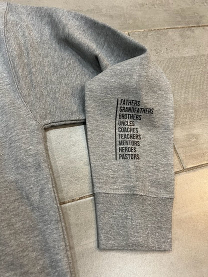 Cozy gray vintage sweatshirt with a nostalgic 'Father Figure' design showcasing four men in a classic graphic print.