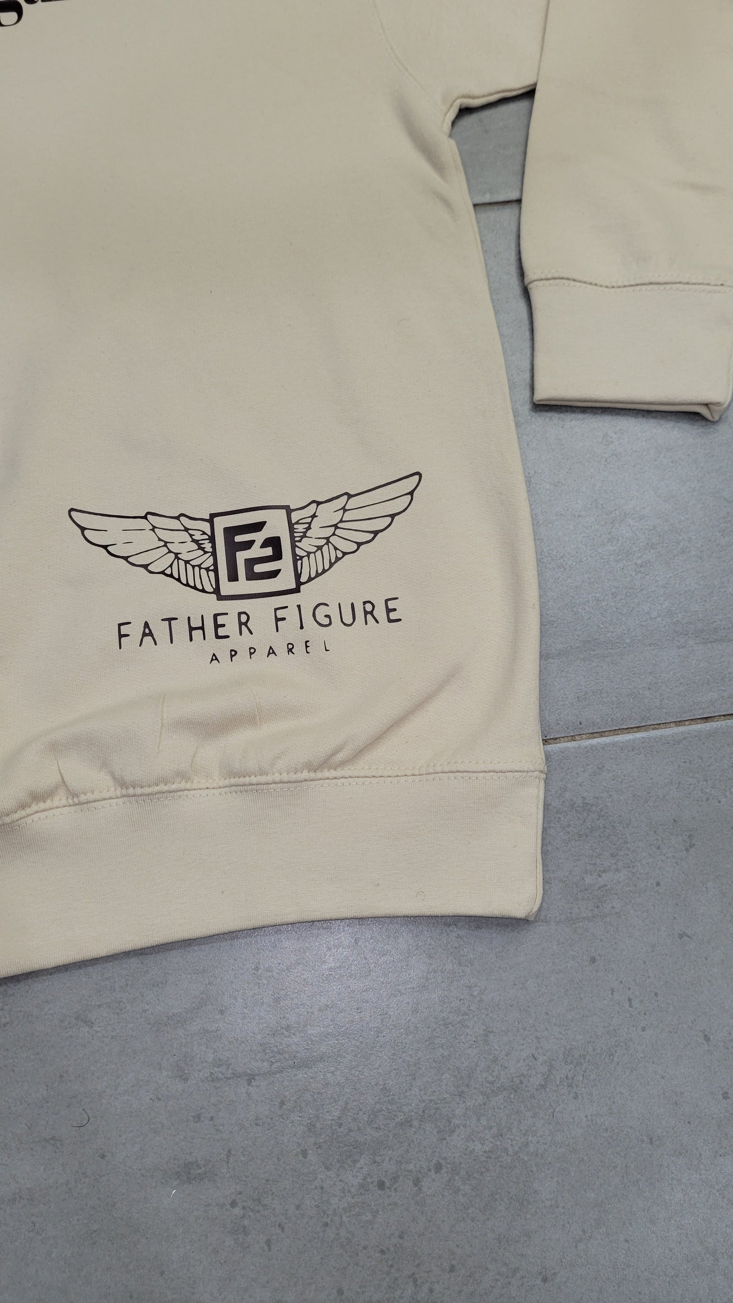 Cozy ivory cream sweatshirt with elegant chocolate script and a subtle F2 wing logo in the corner, perfect for fall and winter.